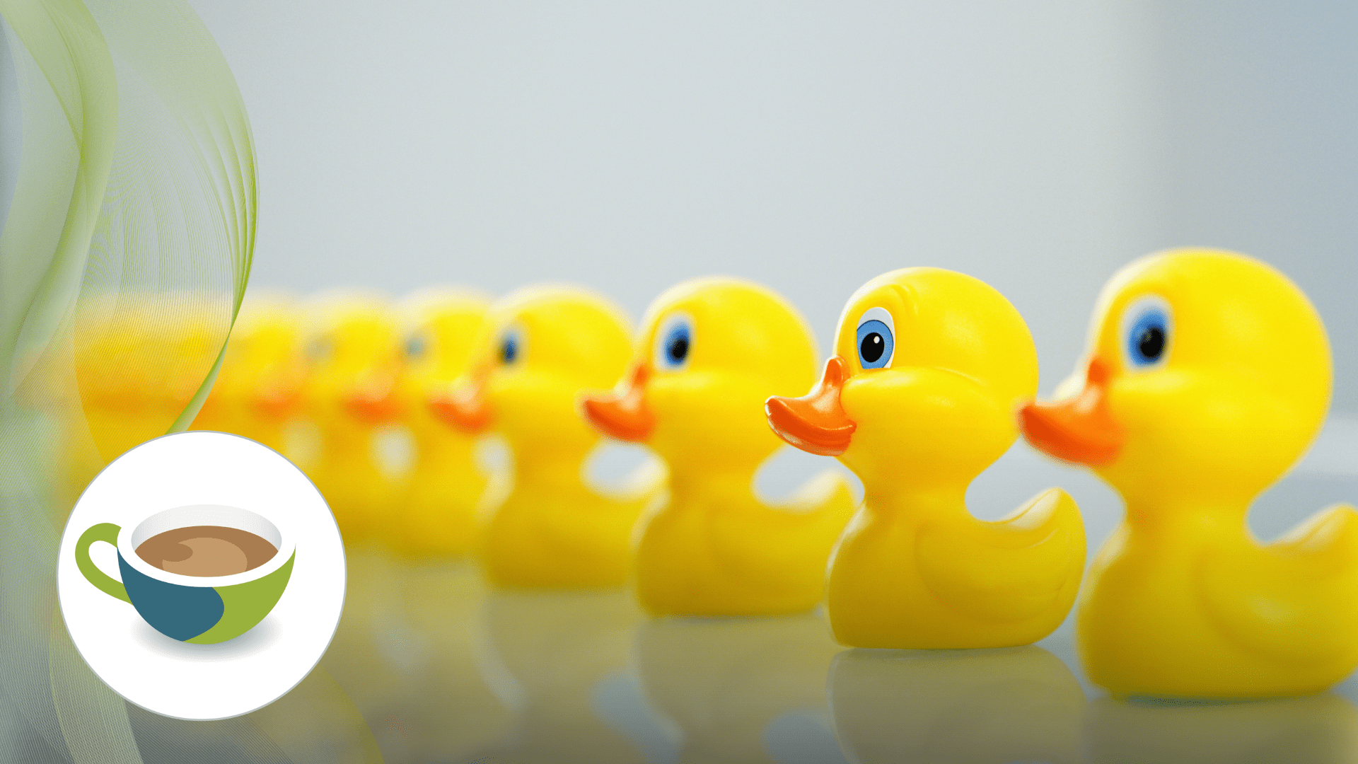 A row of bright yellow rubber ducks lined up on a reflective surface, fading into the background.