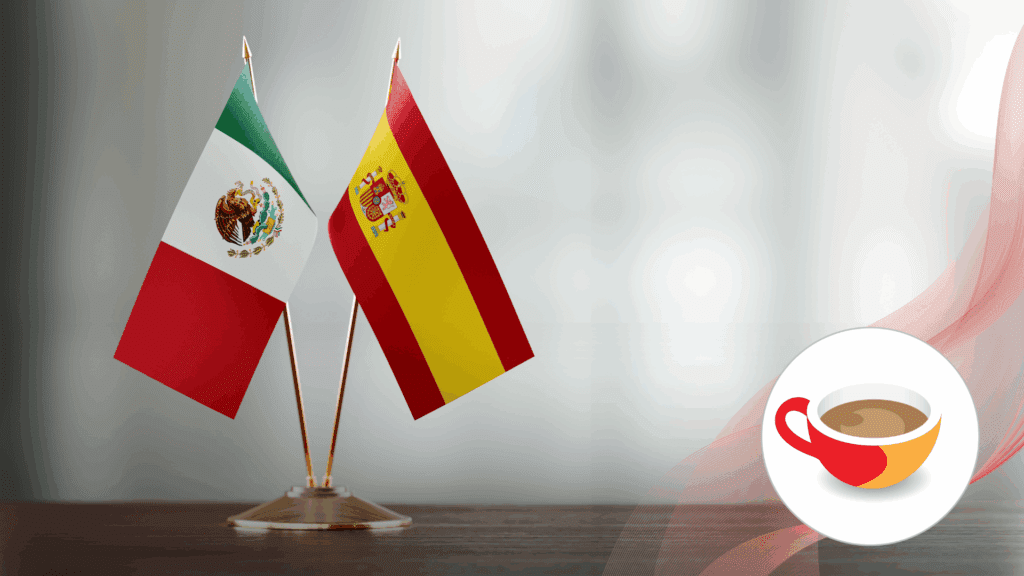 Two small table flags, one of Mexico and one of Spain, crossed over a dark base against a light background