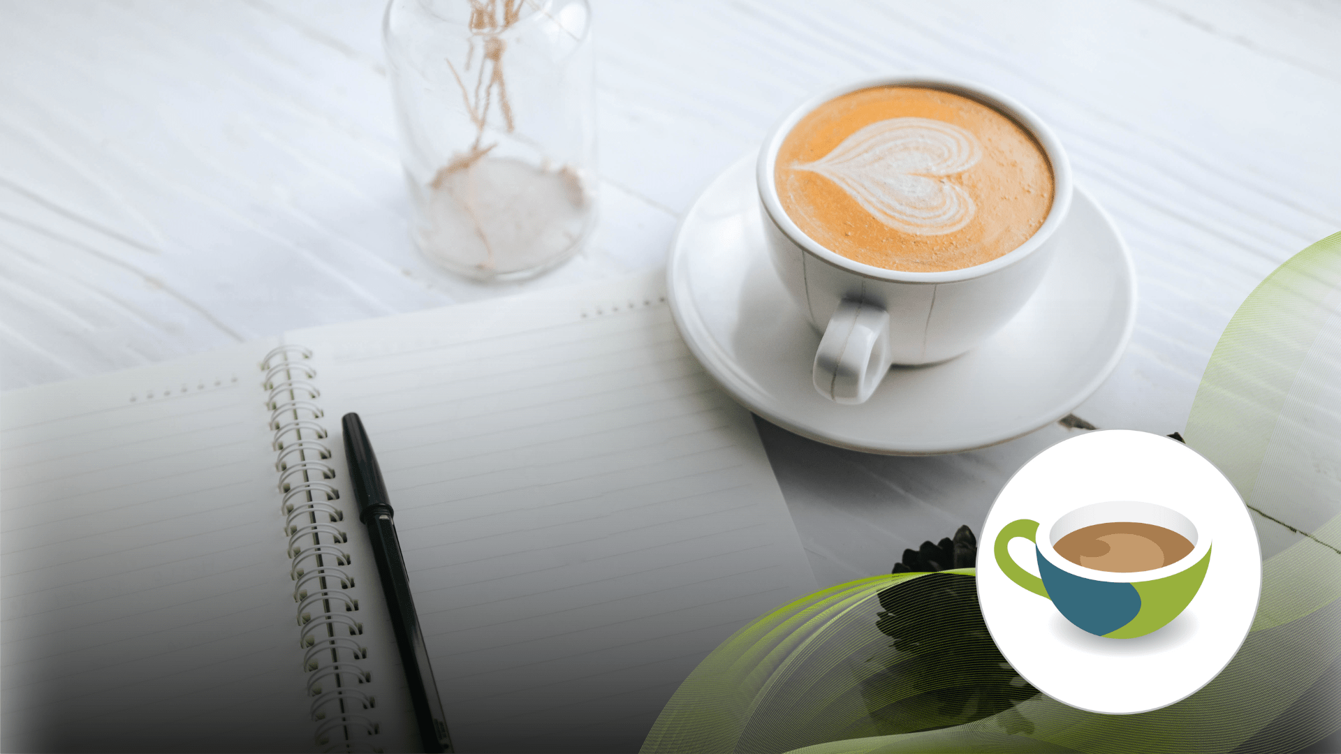 Coffee cup with a notebook beside it.