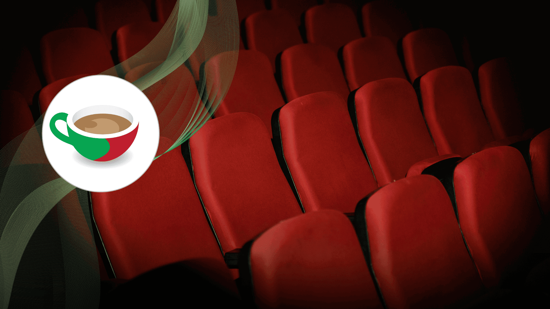Rows of empty red theater seats in a dimly lit cinema