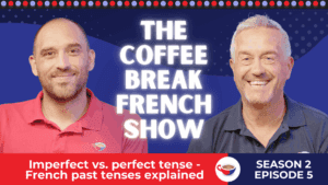 Two smiling men in red and navy shirts standing in front of a blue background