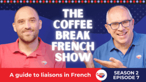 Two smiling men in red and blue shirts standing in front of a dark blue background