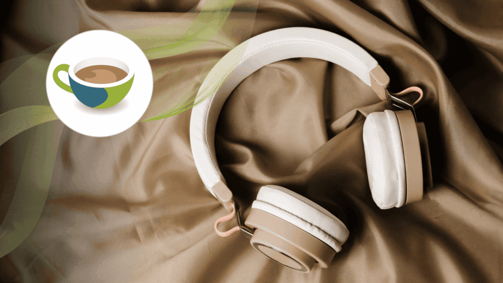 Beige and white over-ear headphones resting on silky brown fabric.