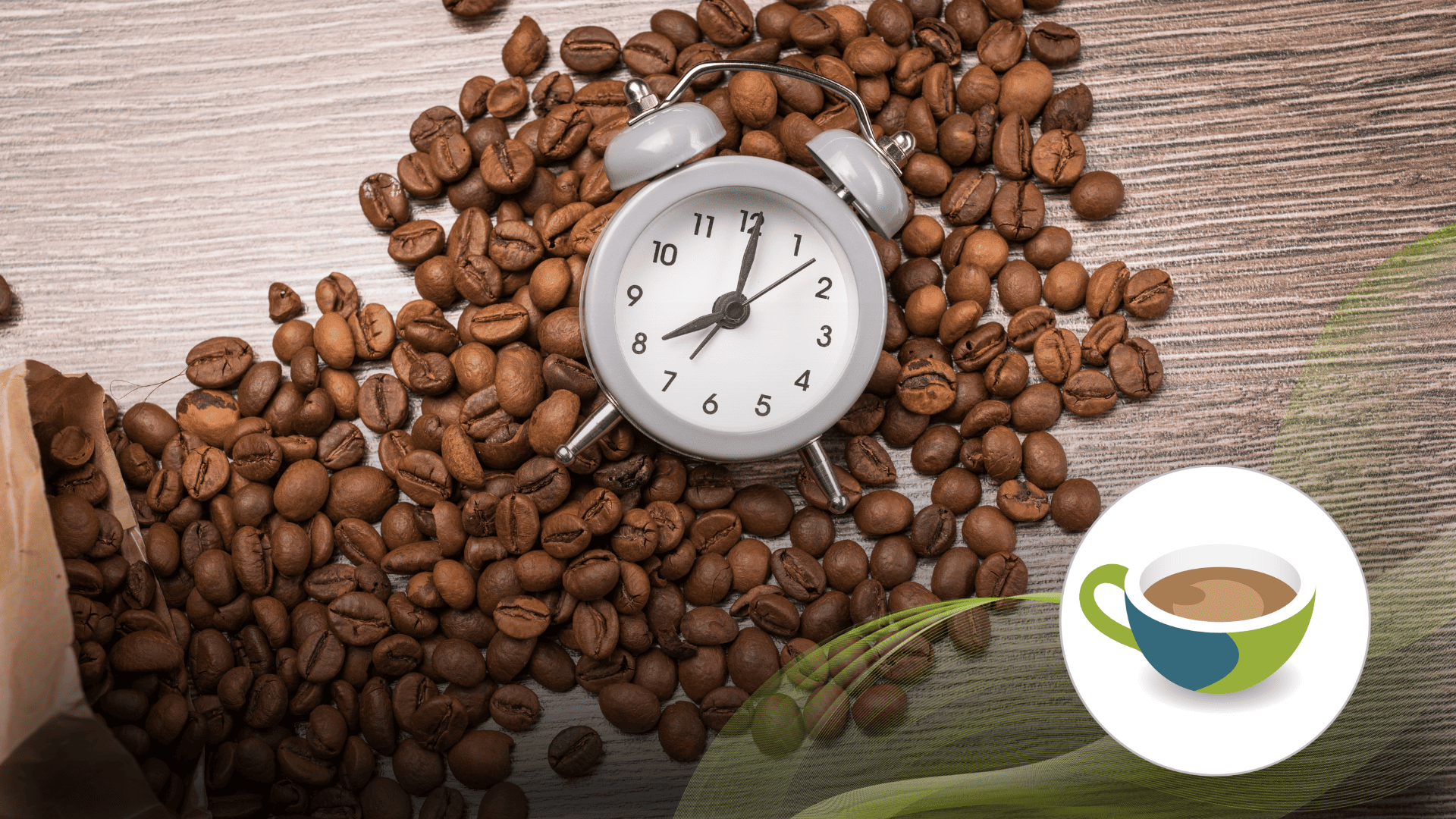A small grey alarm clock surrounded by roasted coffee beans on a wooden surface.