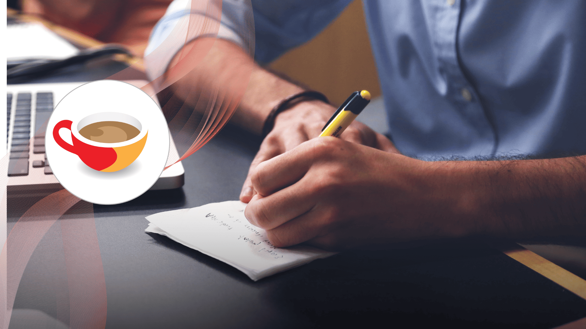 A person writing notes on paper beside a laptop, symbolising active language learning and study.
