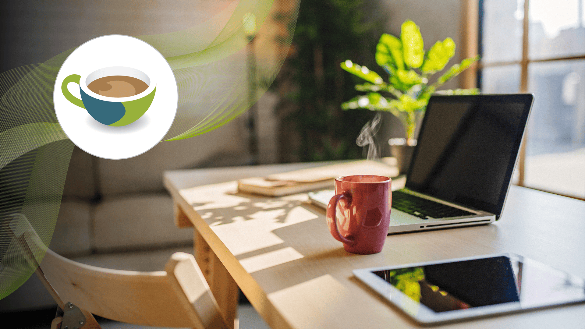 A cosy home workspace with a laptop, tablet, and a steaming red coffee mug on a wooden desk, with soft sunlight streaming through the window.